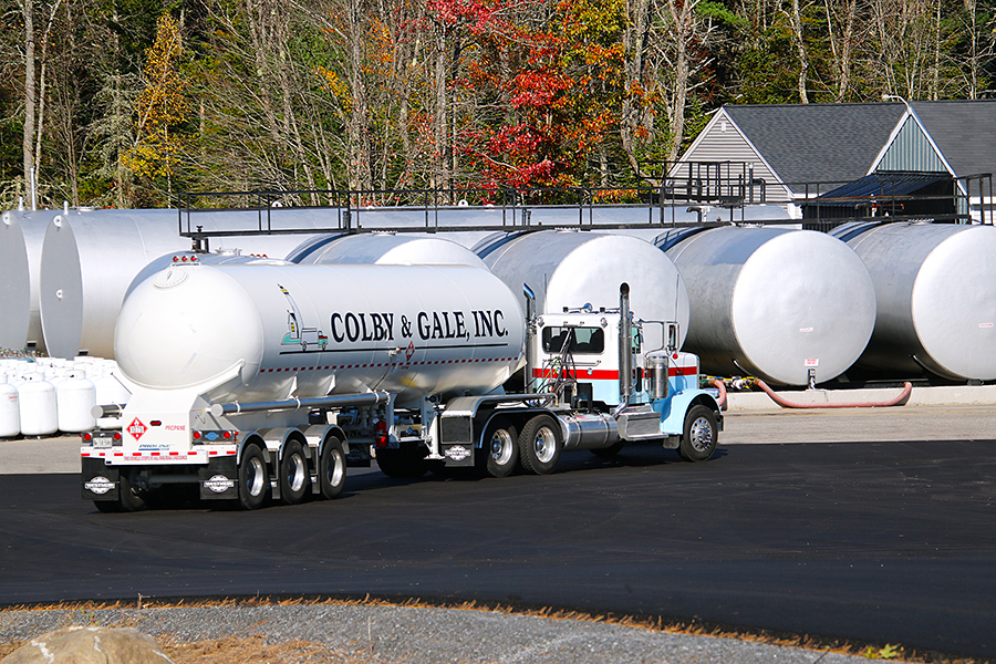 Colby & Gale Propane tanks and a large tanker truck parked in front.