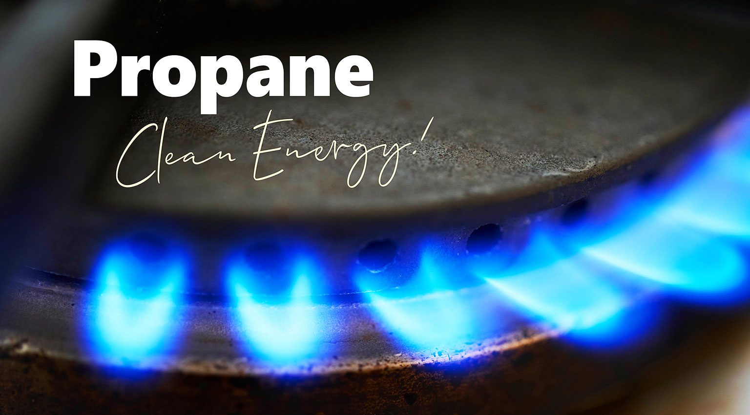A close up of a gas stove with blue flame